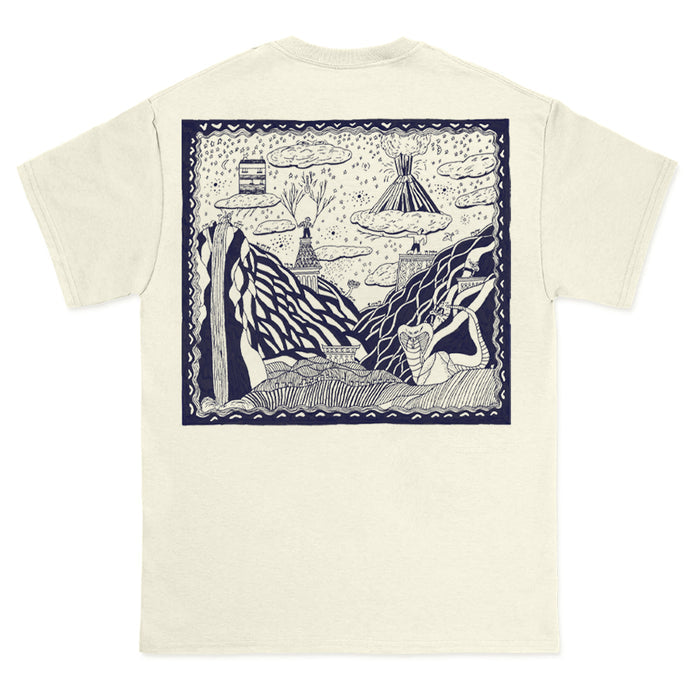 Cream-colored Comfort Colors t-shirt by The Story So Far, featuring a large navy-outlined graphic on the back with a whimsical, hand-drawn scene of mountains, clouds, trees, and a tent among abstract nature elements.