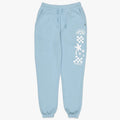 Billabong Girls Making Waves trackpants in bliss blue, with a white graphic print on the right leg, laid flat.