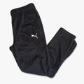 Black Puma Boys Za track pants, folded and displaying the white Puma logo, suitable for athletic wear or casual comfort.