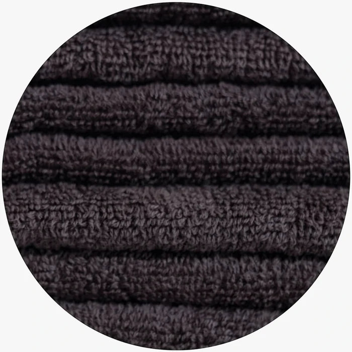 Colibri Galleon Bath Towel Charcoal, showing the soft, folded terry cloth texture in a close-up view.