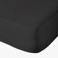 Black Cotton Co 400 Thread King Fitted Sheet, 182X190+40, viewed from a corner angle on a bed.