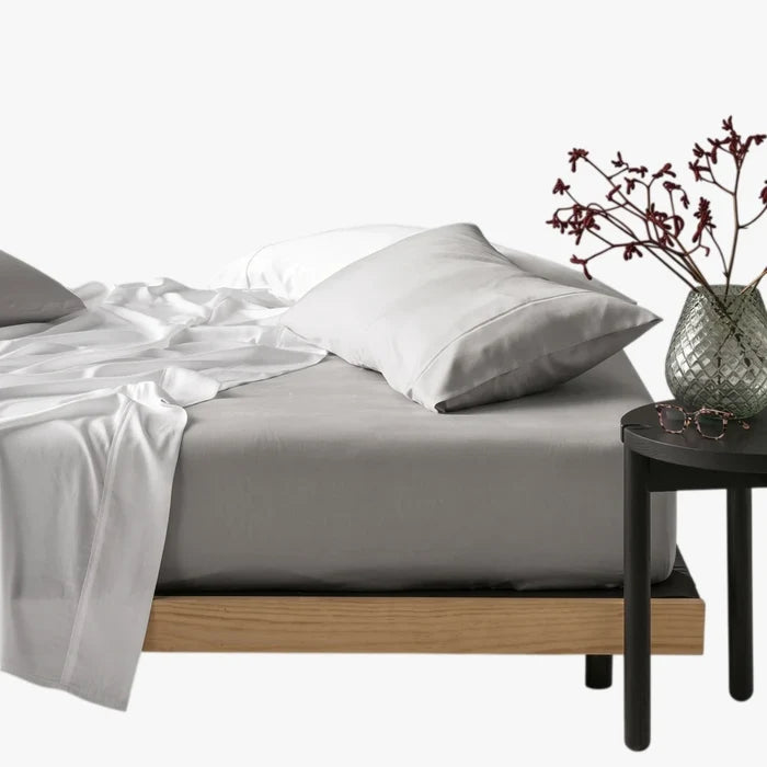 Silver Cotton Co 400 Thread Queen Extra Fitted Sheet, shown on a bed with white bedding and a side table.