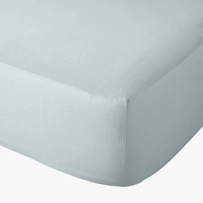 Duck egg blue Cotton Co 400 thread count queen fitted sheet on a mattress, shown in a close-up angled view.