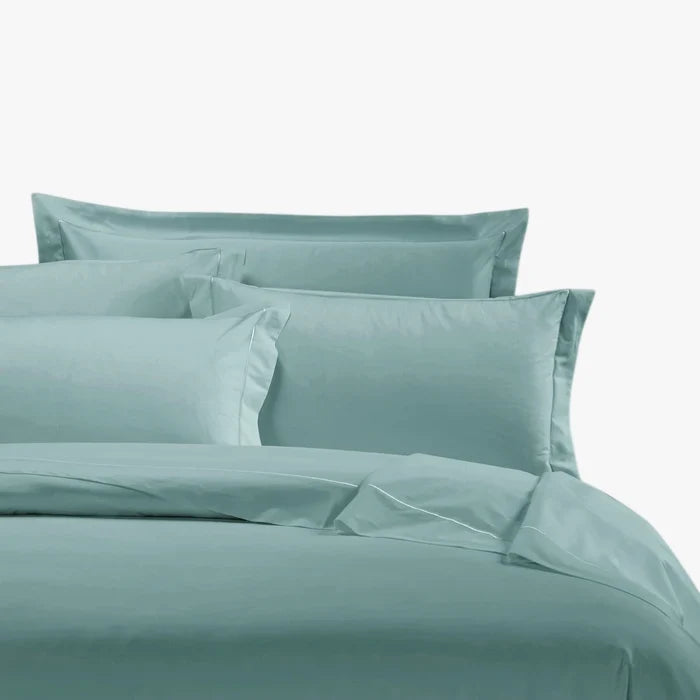 Duck egg blue Egyptian cotton 400 thread count Queen duvet cover set, including folded duvet and pillowcases on a bed.