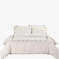 Cotton Co Opulence Antalia King 300 thread count duvet cover set in cream with grey wavy embroidery, arranged neatly on a