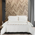 Cotton Co Opulence Antalia Queen 300 Thread Count Duvet Cover Set in cream with subtle brown embroidered edge detail.