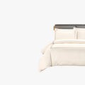 Cream Egyptian cotton Queen duvet cover set from Opulence Emily collection with braided detailing, displayed on a bed.