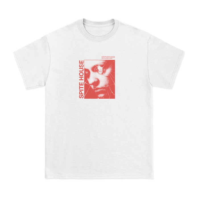 Spite House white T-shirt with a red-tinted face graphic, cracked glass effect, and SPITE HOUSE text running vertically along the image’s left side.