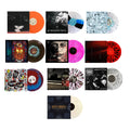 Fourteen limited edition vinyl records with unique album covers and colorful discs, arranged in a grid pattern on a white background. Each vinyl features different artwork and vivid record colors, including orange, red, blue, black, and marbled designs—perfect for collectors seeking a standout colored vinyl bundle.