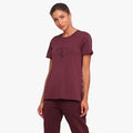 Puma Women's Ferrari Big Shield Short Sleeve Tee in vineyard, featuring a Ferrari shield logo, worn by a woman in a studio